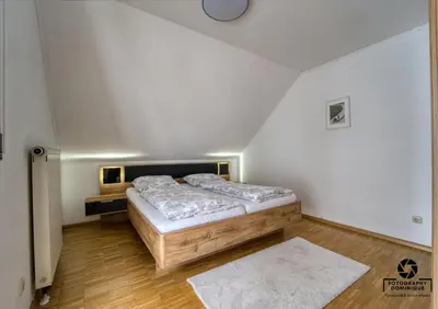 Ein Bett oder Betten in einem Zimmer der Unterkunft Gästehaus Lydia - Mühlenberg