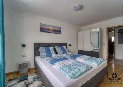 Ein Bett oder Betten in einem Zimmer der Unterkunft Gästehaus Lydia - Klüsserather Bruderschaft