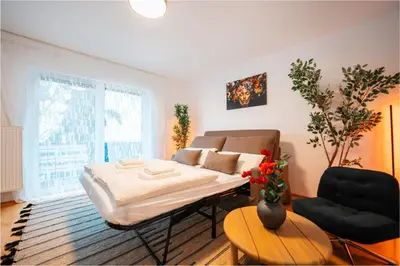 Ein Bett oder Betten in einem Zimmer der Unterkunft Modernes Apartment mit Balkon am Koblenz HBF