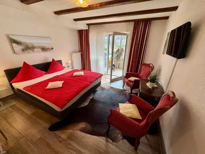 Ein Bett oder Betten in einem Zimmer der Unterkunft Haus Edeltrud - Ferienwohnung Moselufer