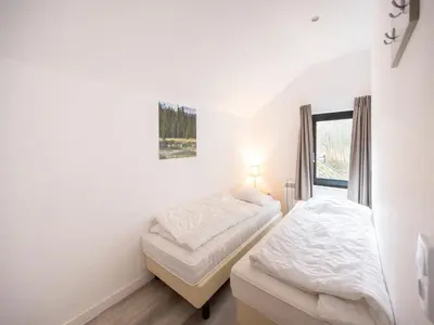 Ein Bett oder Betten in einem Zimmer der Unterkunft Family home in Hambachtal Boutique Resort
