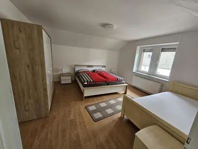 Ein Bett oder Betten in einem Zimmer der Unterkunft Ferienwohnung Zur Lore