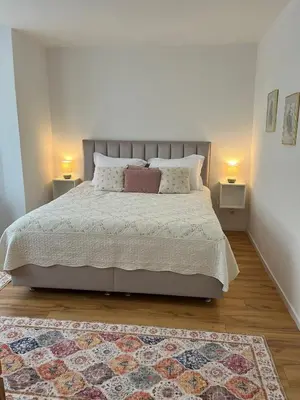 Ein Bett oder Betten in einem Zimmer der Unterkunft Ferienwohnung Blerta