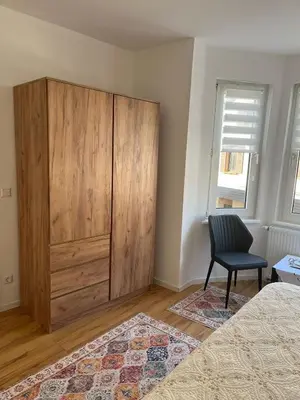 Ein Bett oder Betten in einem Zimmer der Unterkunft Ferienwohnung Blerta