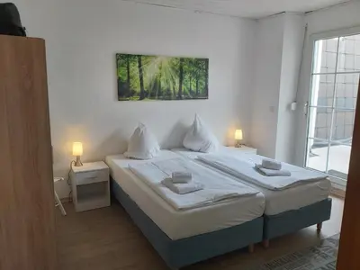 Ein Bett oder Betten in einem Zimmer der Unterkunft Ferienanlage - Am Moselufer