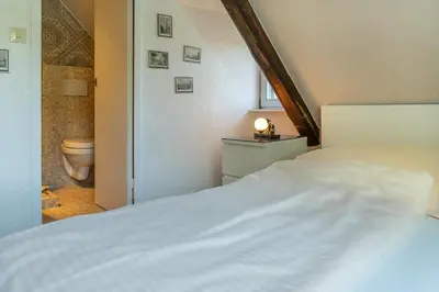 Ein Bett oder Betten in einem Zimmer der Unterkunft Romantisches Hotel zur Post
