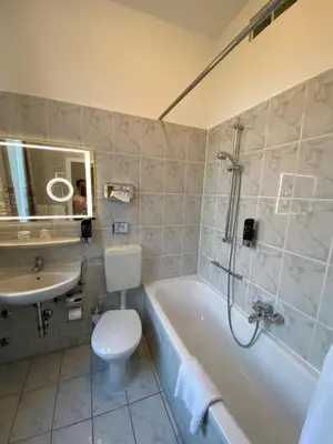 Ein Badezimmer in der Unterkunft Hotel Krone