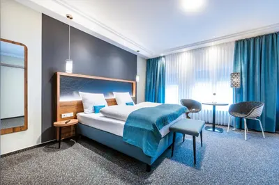 Ein Bett oder Betten in einem Zimmer der Unterkunft Hochwald Lodge
