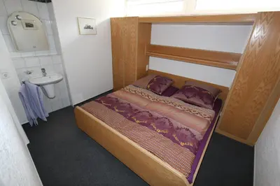 Ein Bett oder Betten in einem Zimmer der Unterkunft Ferienhaus DaVinci