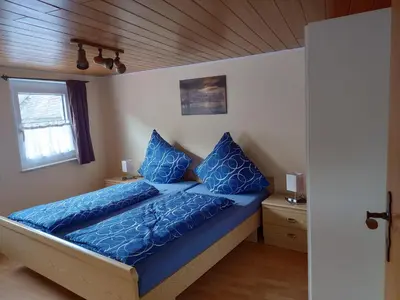 Ein Bett oder Betten in einem Zimmer der Unterkunft Ferienwohnung In der Kehr