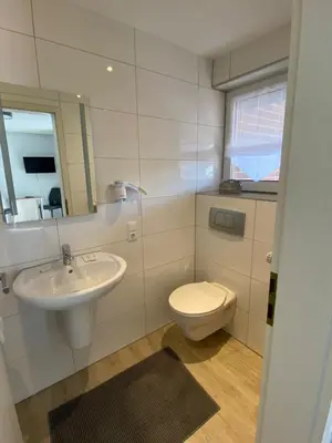 Ein Badezimmer in der Unterkunft Privatzimmer Hoffmann