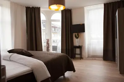 Ein Bett oder Betten in einem Zimmer der Unterkunft Hotel Ravene