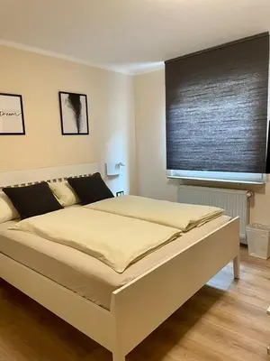 Ein Bett oder Betten in einem Zimmer der Unterkunft Der Stammbaum ORIGIN STAY