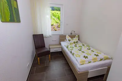 Ein Bett oder Betten in einem Zimmer der Unterkunft Weingut Christoph Müller