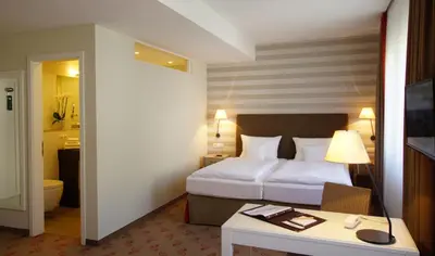 Ein Bett oder Betten in einem Zimmer der Unterkunft Landhotel Sanct Peter