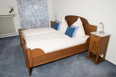 Ein Bett oder Betten in einem Zimmer der Unterkunft Gästehaus-Weingut Loersch