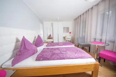 Ein Bett oder Betten in einem Zimmer der Unterkunft Gästehaus-Weingut Loersch