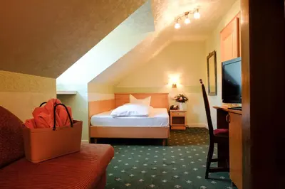 Ein Bett oder Betten in einem Zimmer der Unterkunft Hotel Molitors Mühle