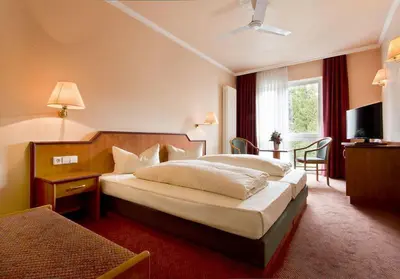 Ein Bett oder Betten in einem Zimmer der Unterkunft Hotel Victoria