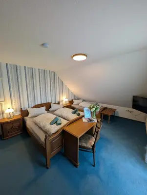 Ein Bett oder Betten in einem Zimmer der Unterkunft Zenners Landhotel