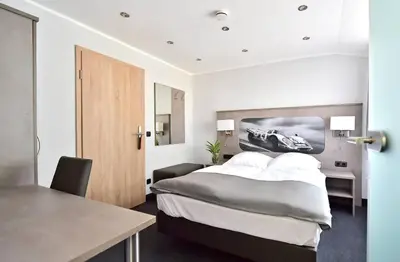 Ein Bett oder Betten in einem Zimmer der Unterkunft GT3 Hotel