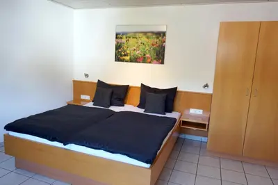 Ein Bett oder Betten in einem Zimmer der Unterkunft Gästehaus Kiebel