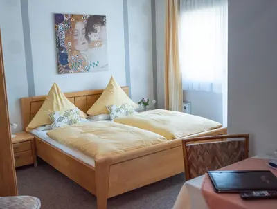 Ein Bett oder Betten in einem Zimmer der Unterkunft Perle am Rhein