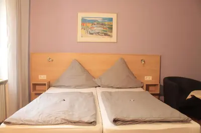 Ein Bett oder Betten in einem Zimmer der Unterkunft Pension Bartz