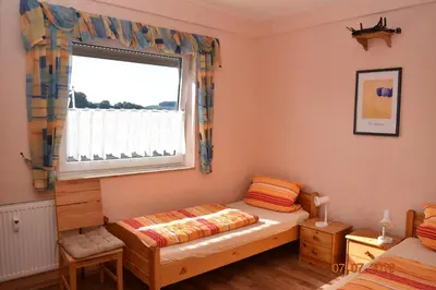 Ein Bett oder Betten in einem Zimmer der Unterkunft Ferienweingut Borens