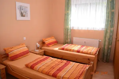 Ein Bett oder Betten in einem Zimmer der Unterkunft Ferienweingut Borens