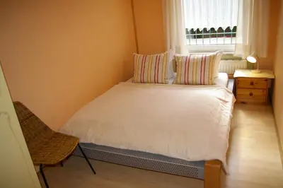Ein Bett oder Betten in einem Zimmer der Unterkunft Ferienhaus Waldrand
