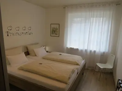 Ein Bett oder Betten in einem Zimmer der Unterkunft Ferienwohnung Am Garten