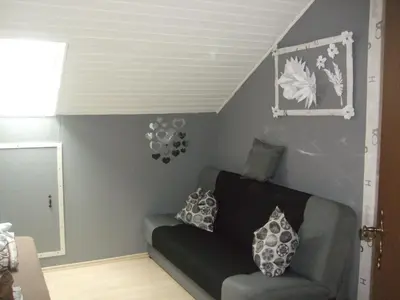 Ein Sitzbereich in der Unterkunft Ferienwohnung Schäfer