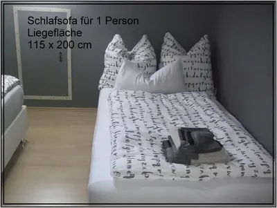 Ein Bett oder Betten in einem Zimmer der Unterkunft Ferienwohnung Schäfer