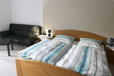 Ein Bett oder Betten in einem Zimmer der Unterkunft Pension Garni Haus Bismarckhöhe