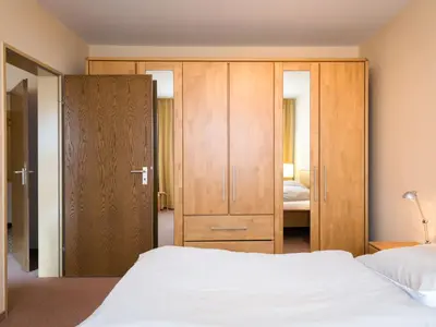 Ein Bett oder Betten in einem Zimmer der Unterkunft Apartment Birke - A504 by Interhome