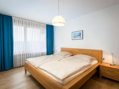 Ein Bett oder Betten in einem Zimmer der Unterkunft Apartment Hortensie - A701 by Interhome