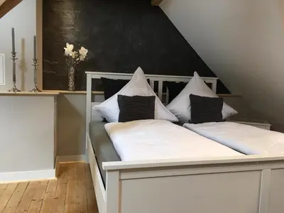 Ein Bett oder Betten in einem Zimmer der Unterkunft Holiday Trier City