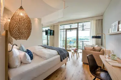 Ein Bett oder Betten in einem Zimmer der Unterkunft Seezeitlodge Hotel & Spa
