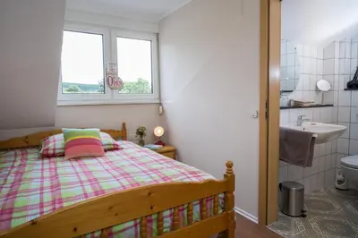Ein Bett oder Betten in einem Zimmer der Unterkunft Landhotel Eifellust