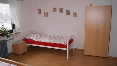 Ein Bett oder Betten in einem Zimmer der Unterkunft Haus Straus
