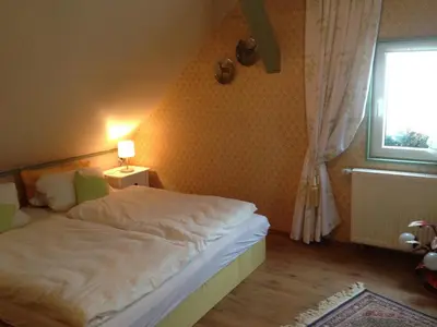 Ein Bett oder Betten in einem Zimmer der Unterkunft Romantikmühle Heartlandranch