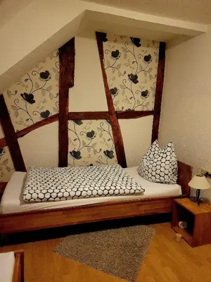 Ein Bett oder Betten in einem Zimmer der Unterkunft Haus Alte Schule