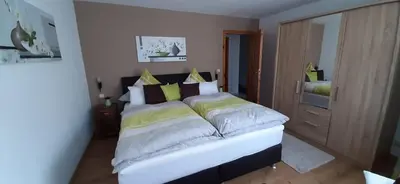 Ein Bett oder Betten in einem Zimmer der Unterkunft Gästehaus Probst