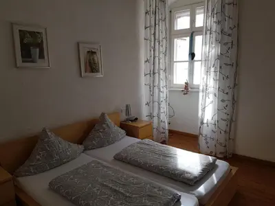 Ein Bett oder Betten in einem Zimmer der Unterkunft Weingut-Klosterhof