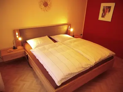 Ein Bett oder Betten in einem Zimmer der Unterkunft FeWo Sonnenblume mit sauna