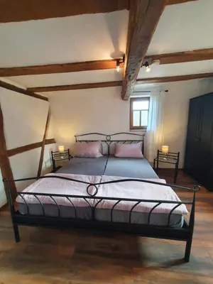 Ein Bett oder Betten in einem Zimmer der Unterkunft Ferienhaus Schmitt