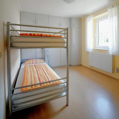 Ein Bett oder Betten in einem Zimmer der Unterkunft Ferienwohnung Hoffmann - Eifel