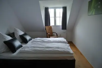Ein Bett oder Betten in einem Zimmer der Unterkunft Gästehaus Sektstuuf St. Laurentius