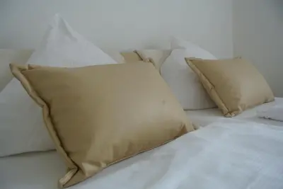 Ein Bett oder Betten in einem Zimmer der Unterkunft Gästehaus Sektstuuf St. Laurentius